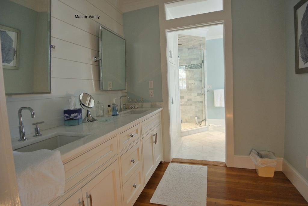 14 Ice Valley Road Osterville, MA 02655 - Photo 18 of 35 a bathroom with a double vanity sink and a mirror