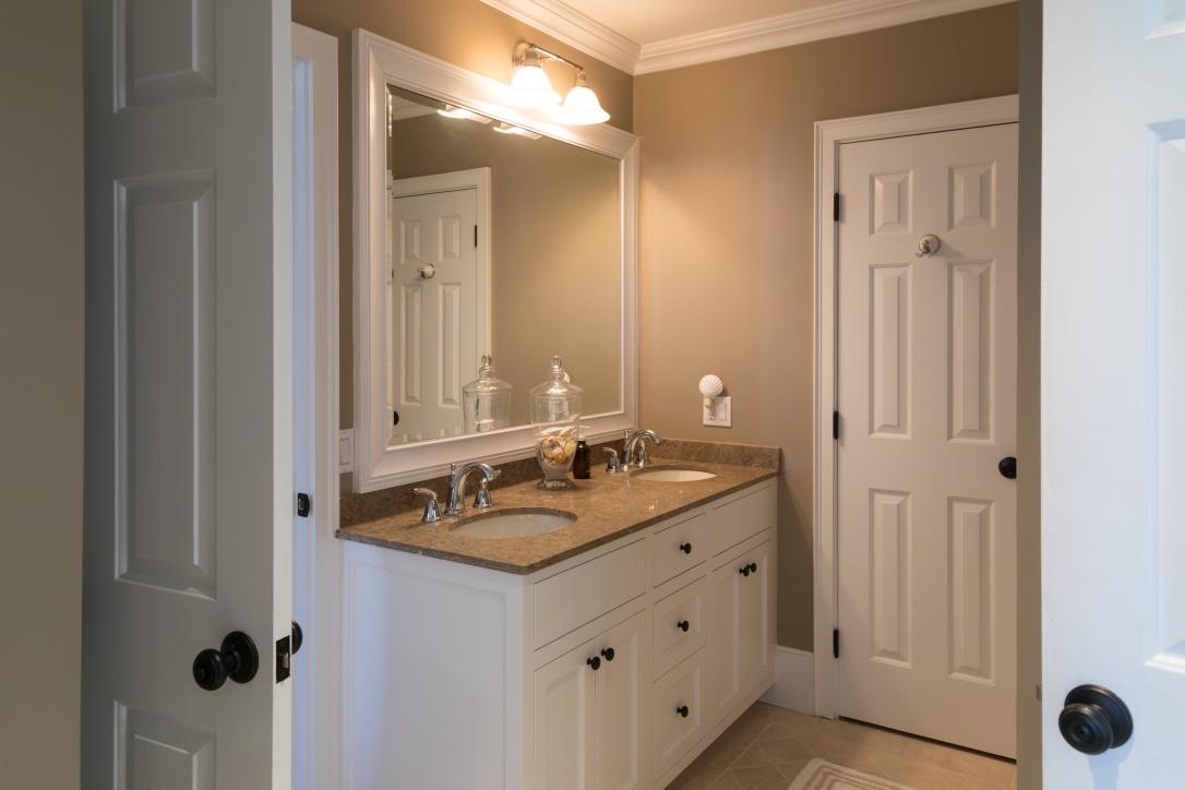 14 Ice Valley Road Osterville, MA 02655 - Photo 21 of 35 a bathroom with a granite countertop sink and a mirror