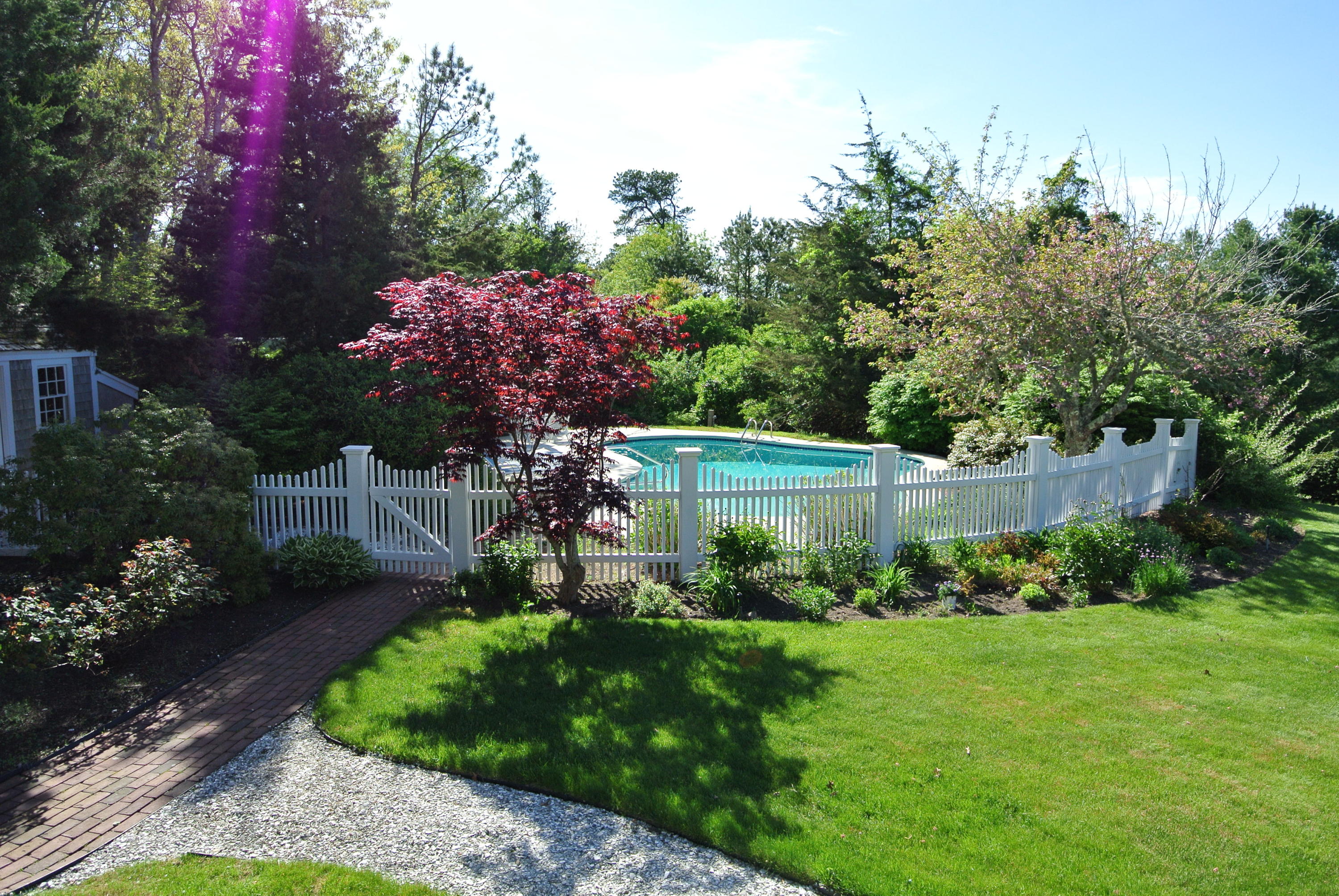 14 Ice Valley Road Osterville, MA 02655 - Photo 27 of 35 a view of a garden with flowers and trees