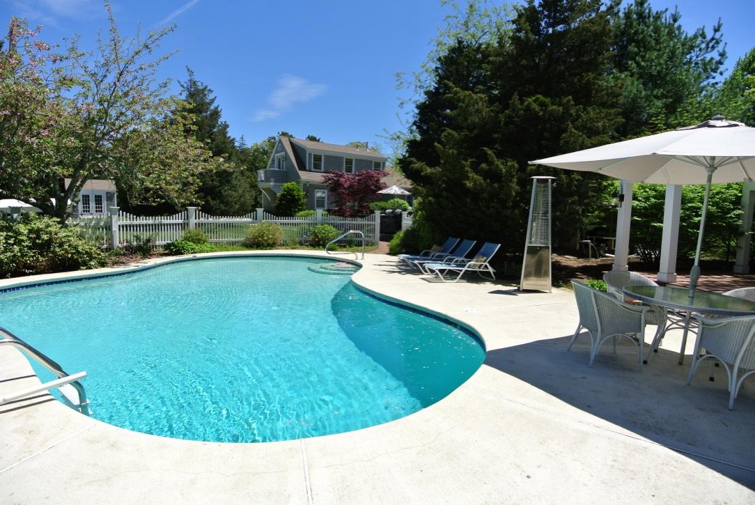 14 Ice Valley Road Osterville, MA 02655 - Photo 3 of 35 a view of a swimming pool with chairs in patio