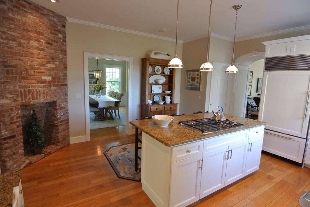14 Ice Valley Road Osterville, MA 02655 - Photo 10 of 35 a kitchen with a stove and a wooden floor