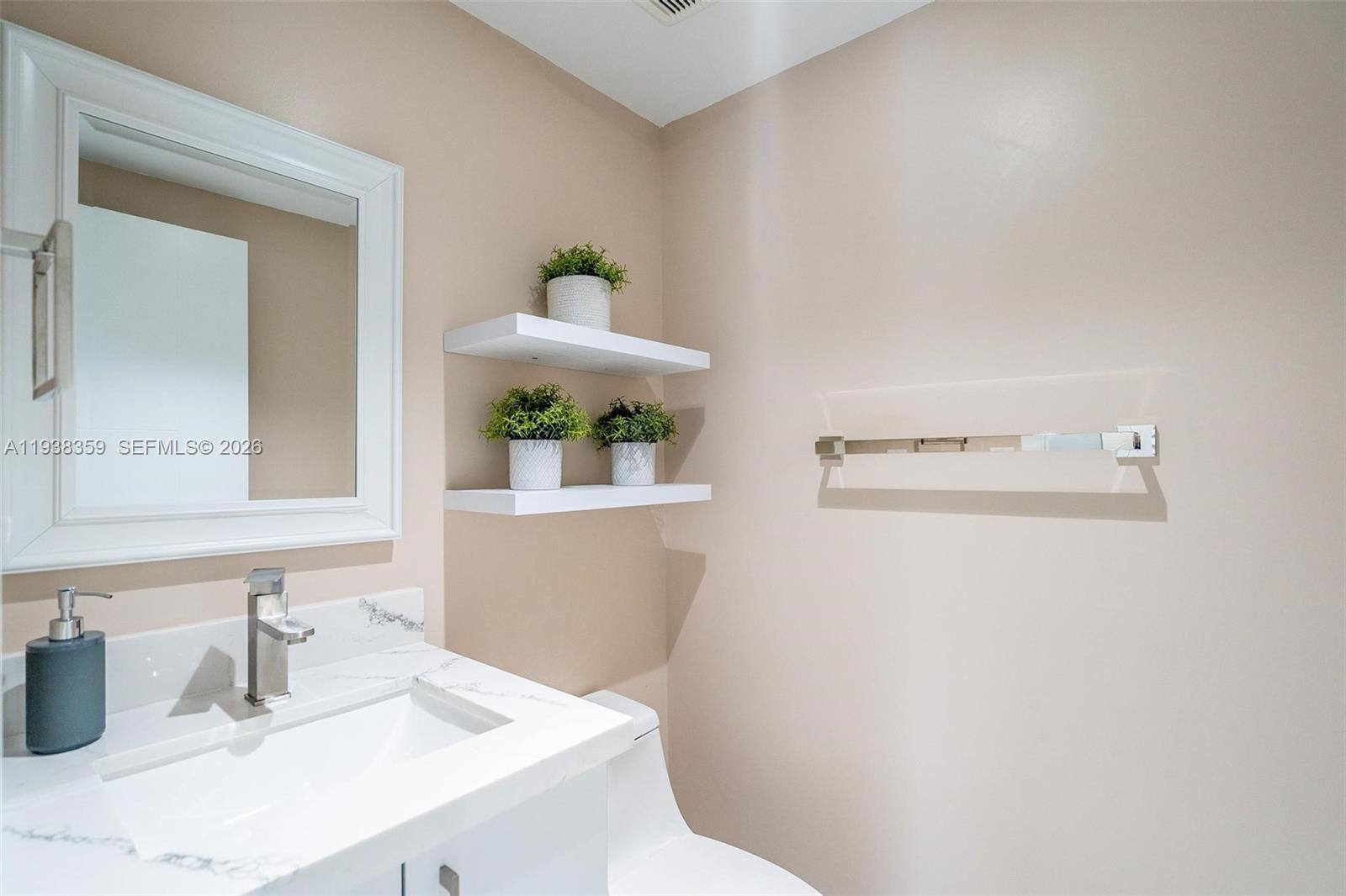 20221 Southwest 318th Street Homestead, FL 33030 - Photo 11 of 37 a bathroom with a sink and a mirror