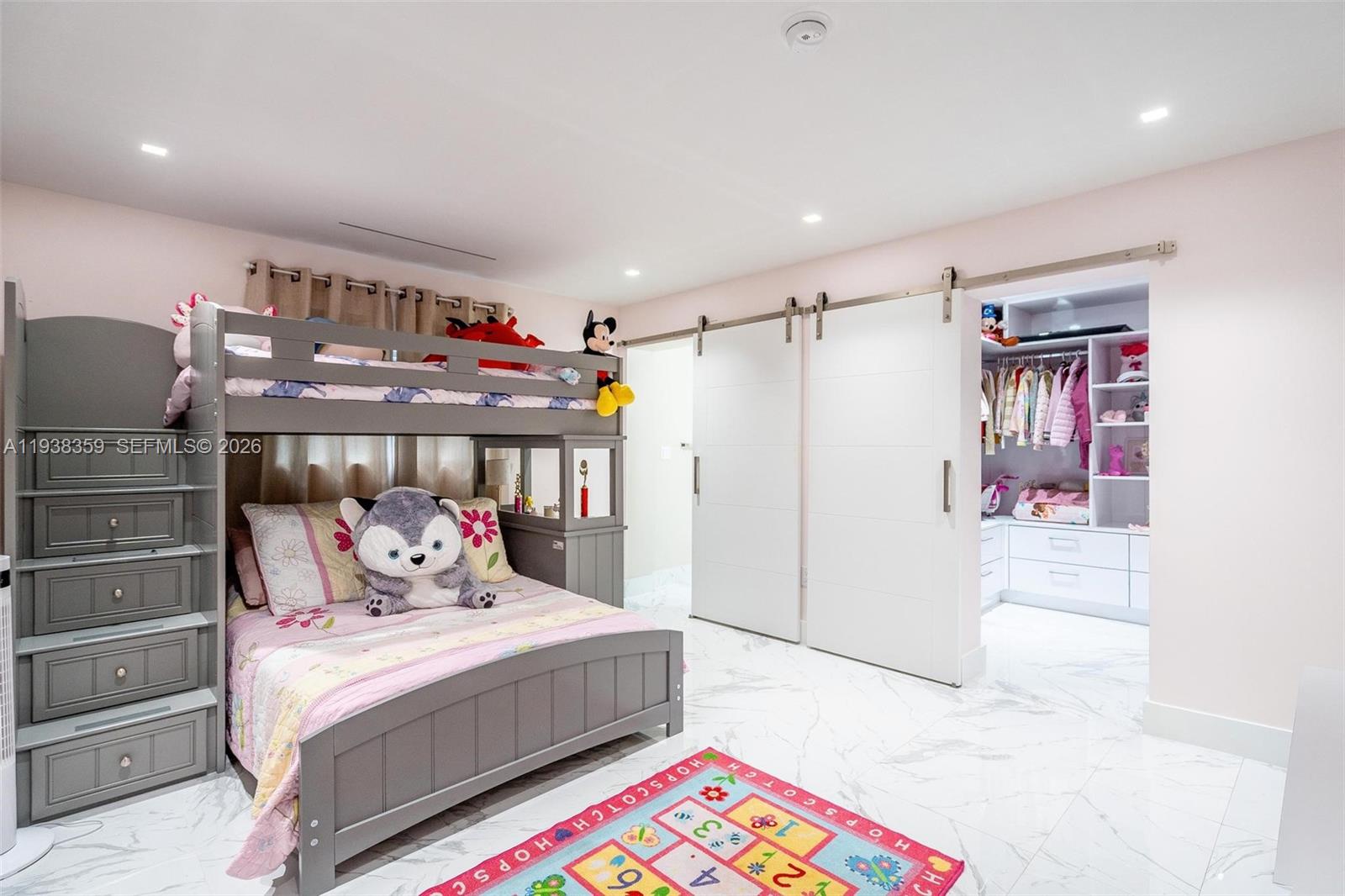 20221 Southwest 318th Street Homestead, FL 33030 - Photo 13 of 37 a bedroom with a bed and a refrigerator