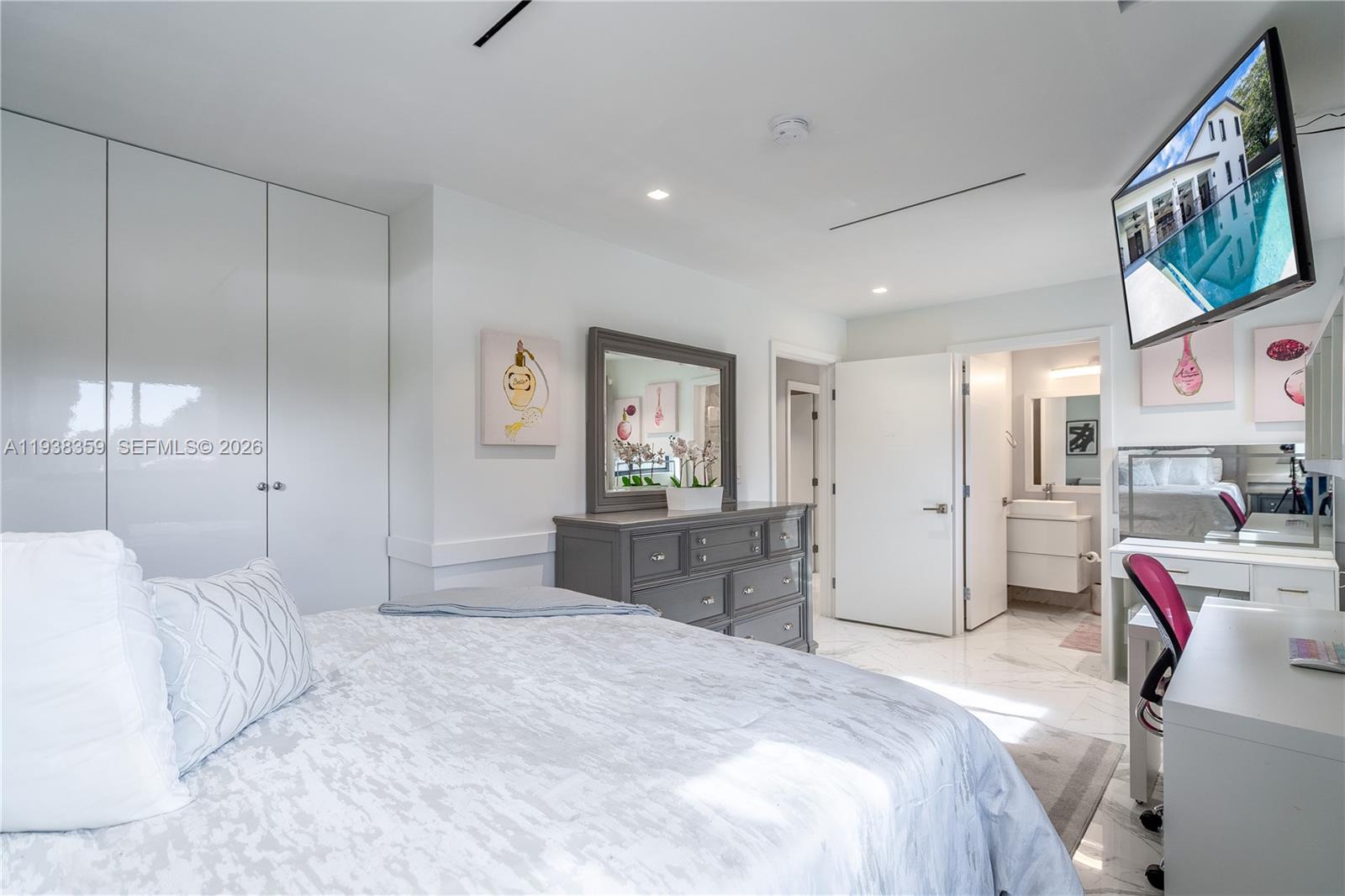 20221 Southwest 318th Street Homestead, FL 33030 - Photo 15 of 37 a bedroom with a bed and dresser