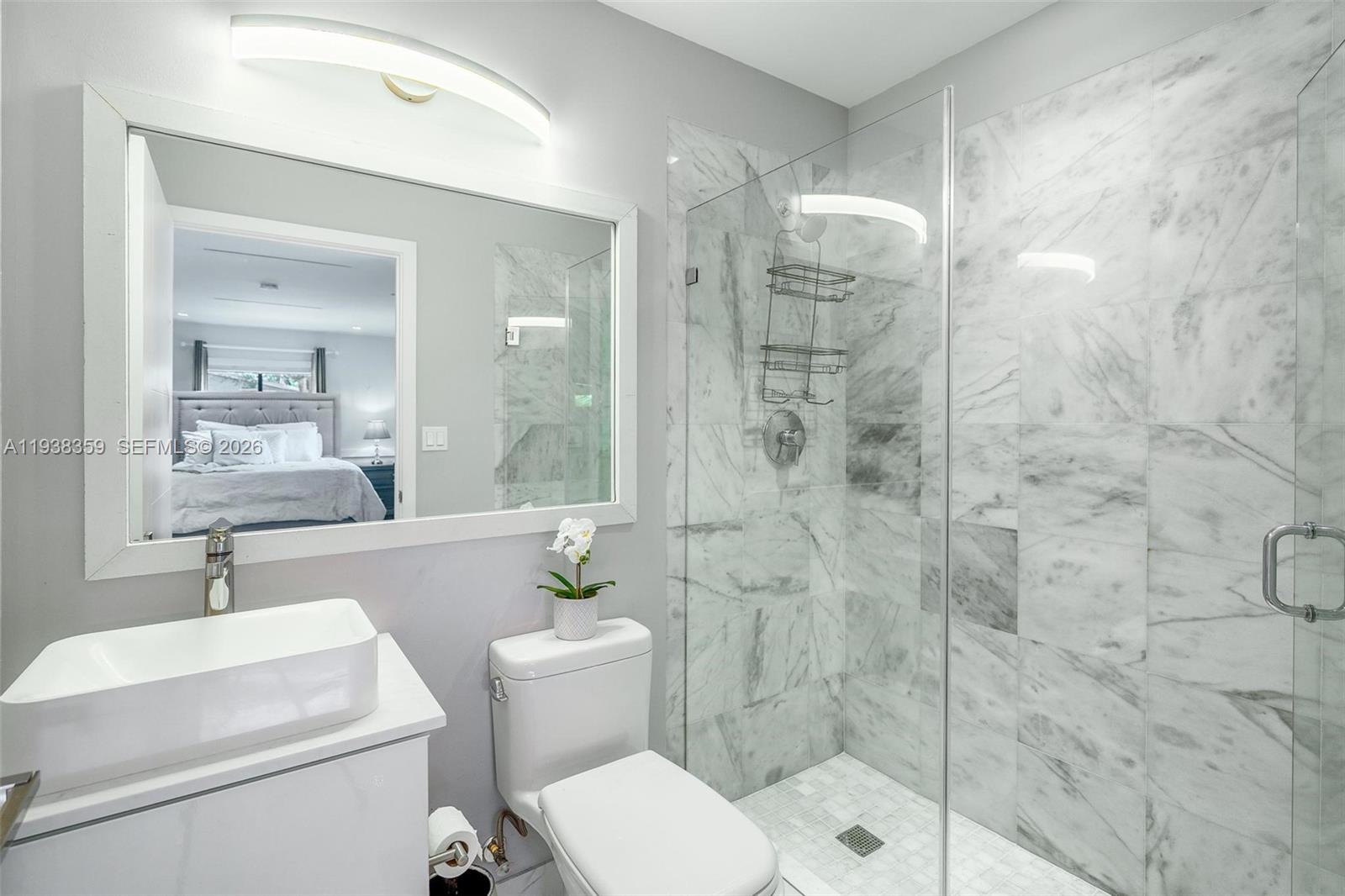 20221 Southwest 318th Street Homestead, FL 33030 - Photo 17 of 37 a bathroom with a toilet sink and shower