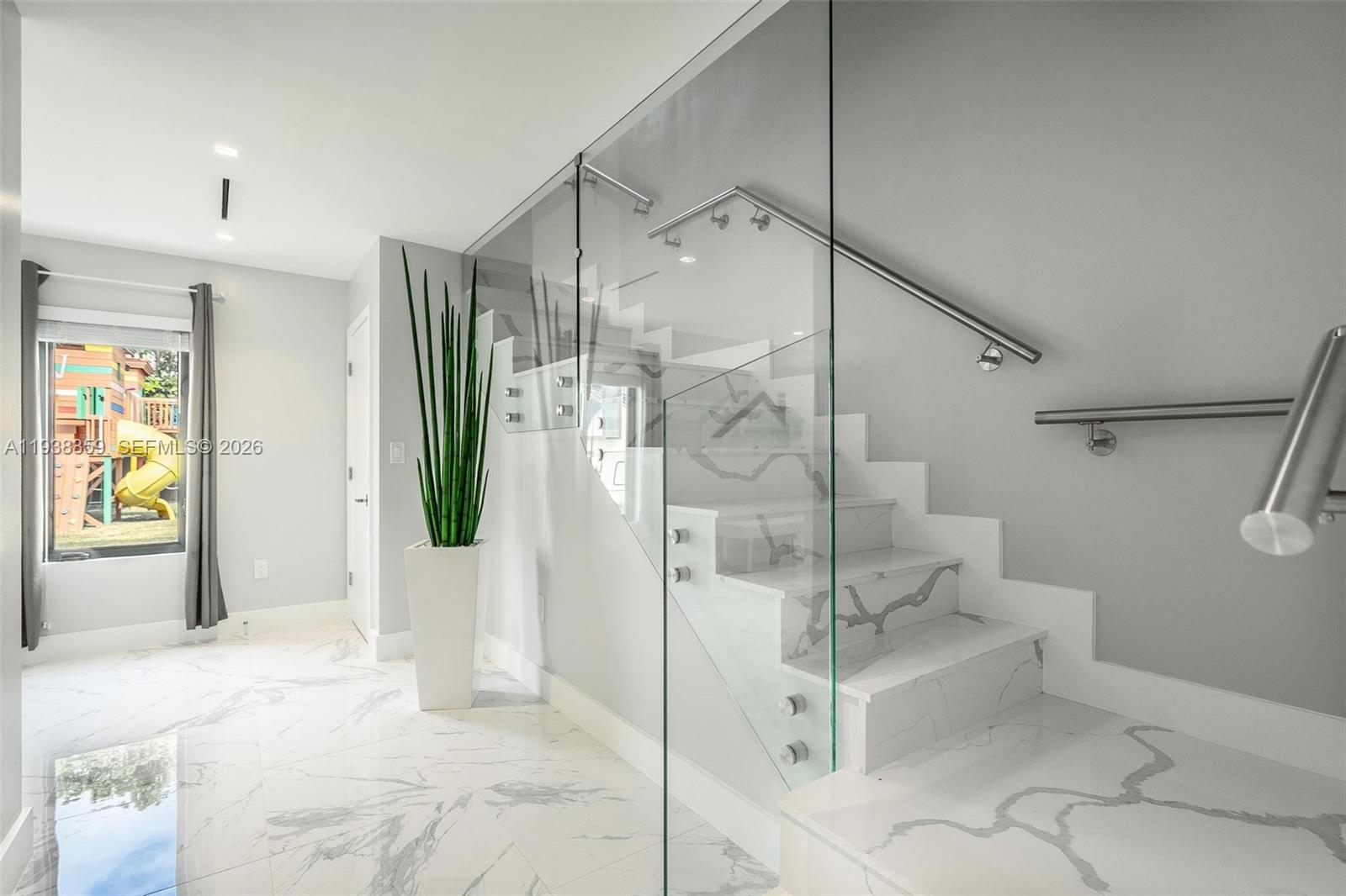 20221 Southwest 318th Street Homestead, FL 33030 - Photo 19 of 37 a bathroom with a glass shower door and a bathtub