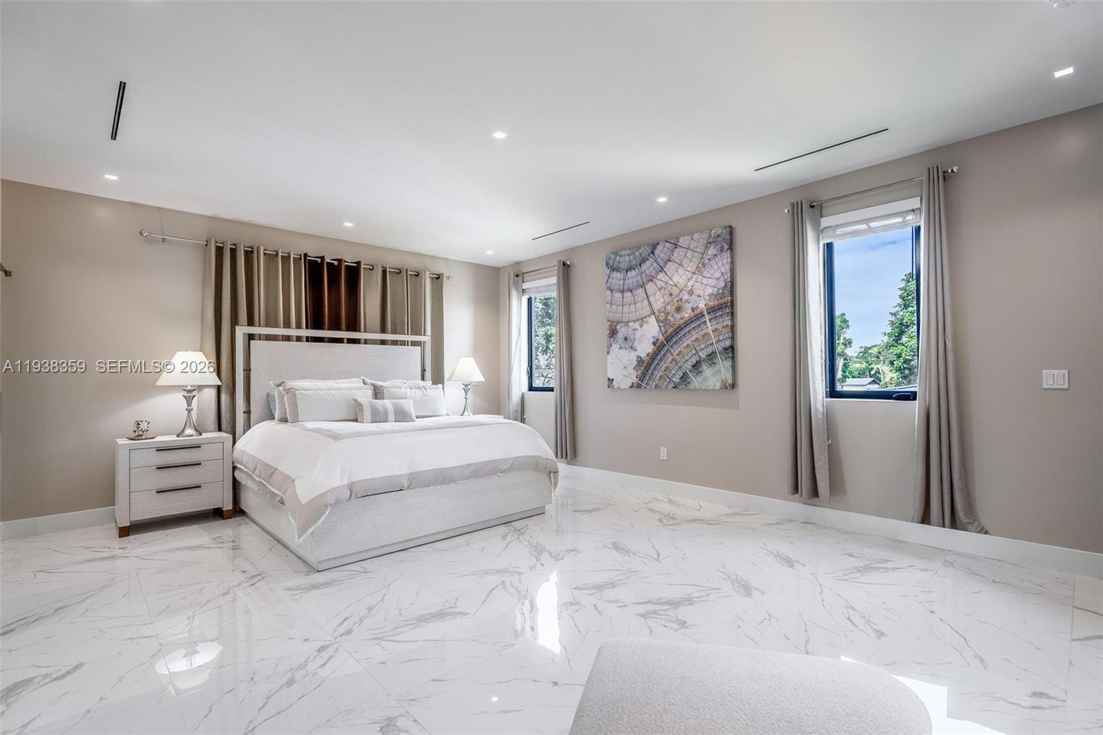 20221 Southwest 318th Street Homestead, FL 33030 - Photo 21 of 37 a bedroom with a large bed and a large window