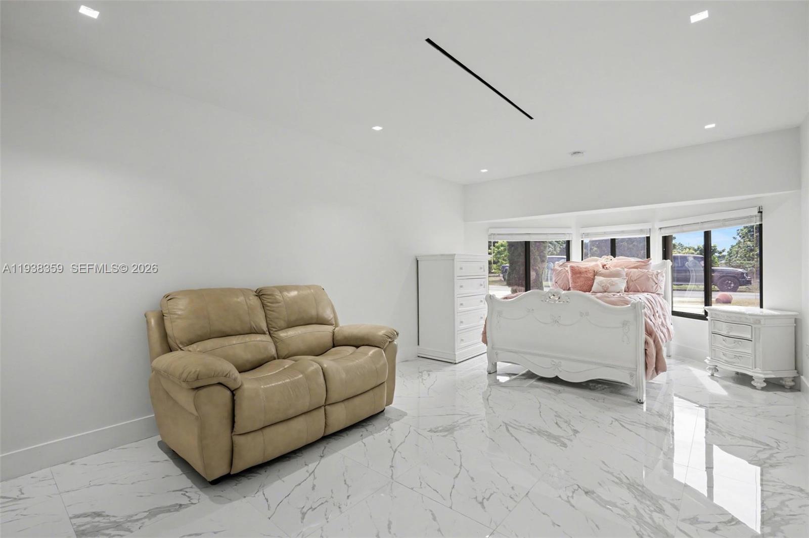 20221 Southwest 318th Street Homestead, FL 33030 - Photo 25 of 37 a living room with furniture and a flat screen tv