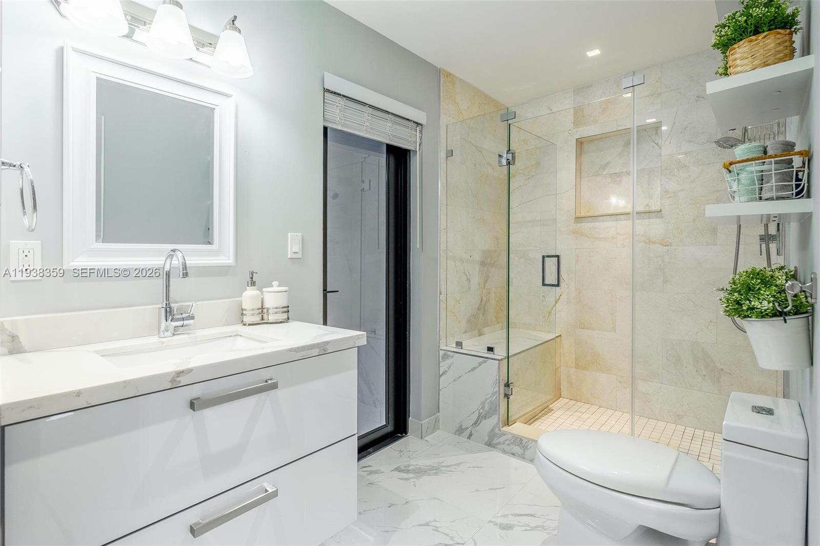 20221 Southwest 318th Street Homestead, FL 33030 - Photo 26 of 37 a bathroom with a sink a toilet and shower