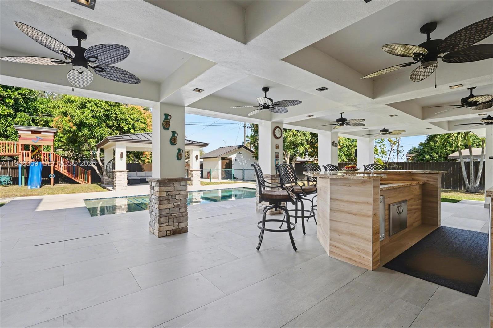 20221 Southwest 318th Street Homestead, FL 33030 - Photo 29 of 37 a view of a livingroom with furniture and a table