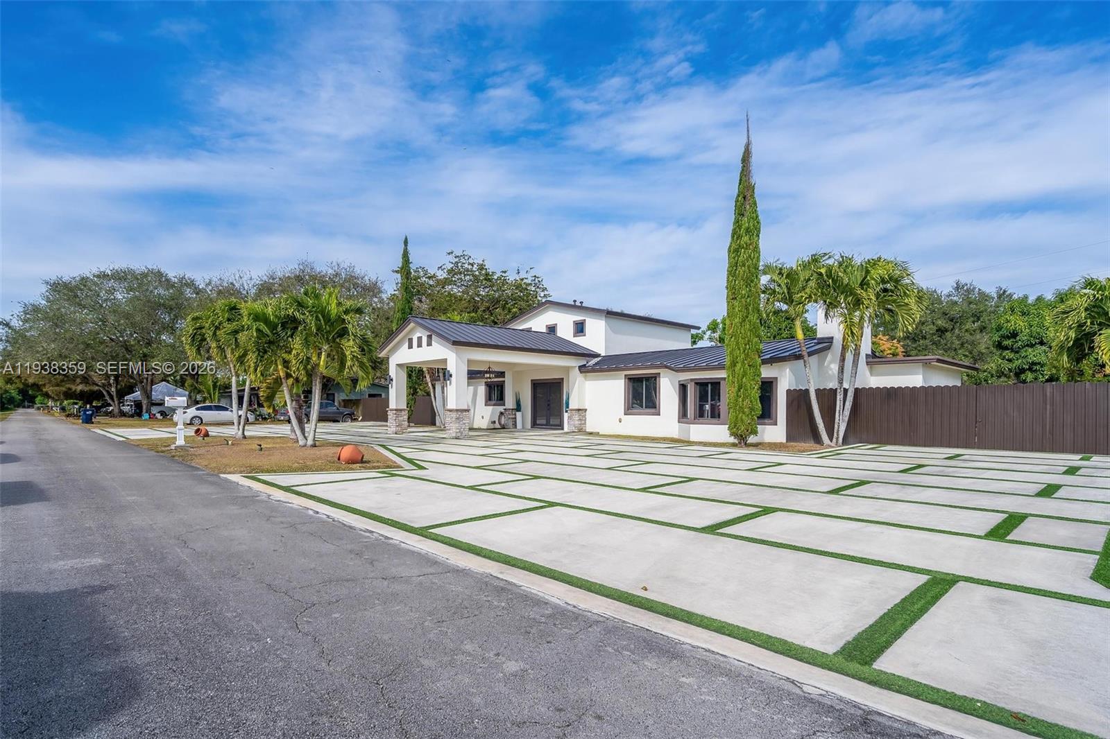 20221 Southwest 318th Street Homestead, FL 33030 - Photo 3 of 37 front view of a house with a patio
