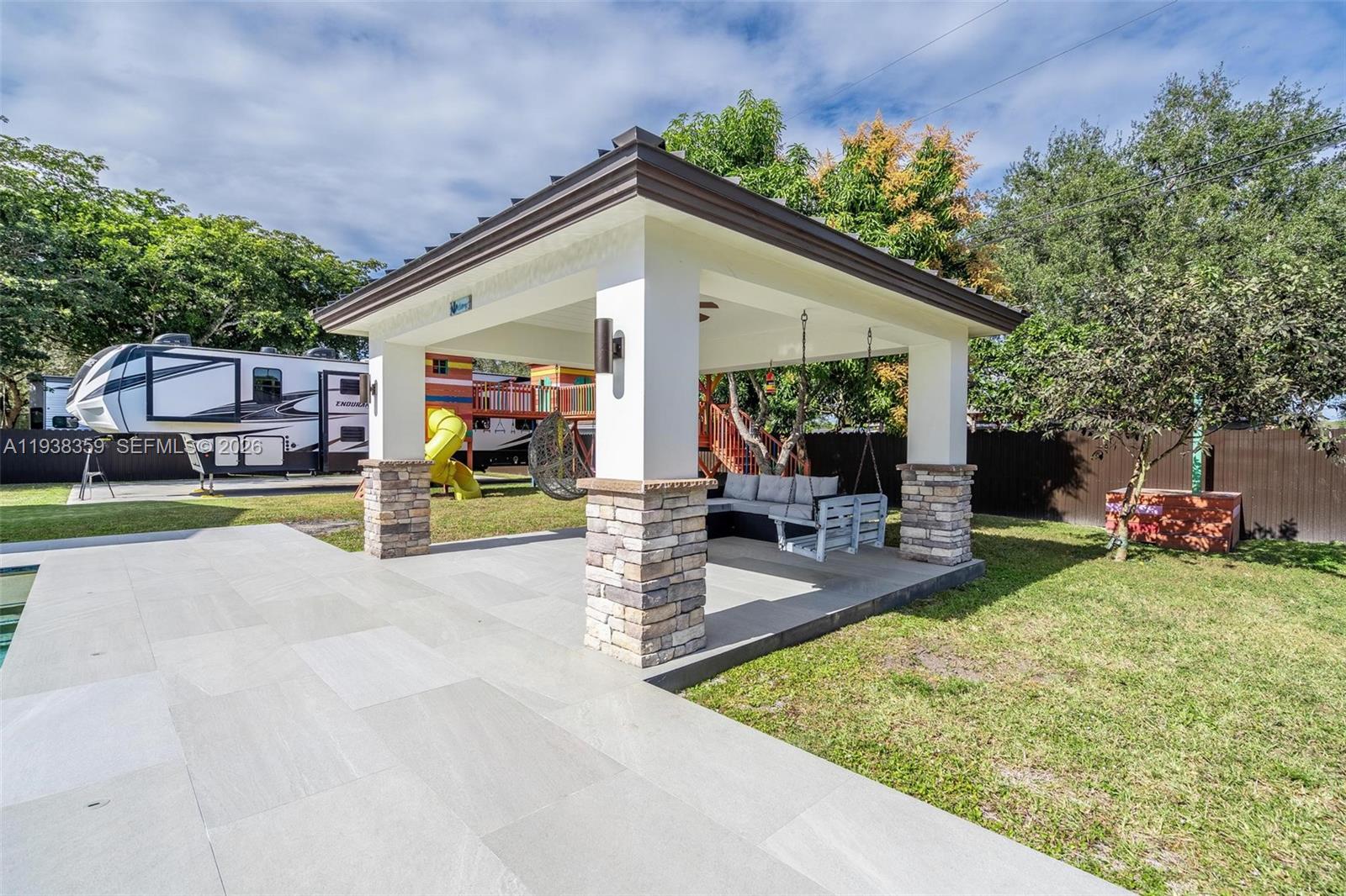 20221 Southwest 318th Street Homestead, FL 33030 - Photo 32 of 37 a view of a house with backyard and sitting area