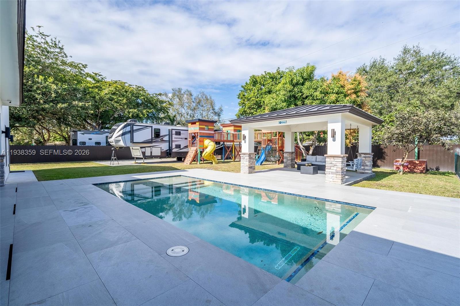 20221 Southwest 318th Street Homestead, FL 33030 - Photo 34 of 37 a view of a swimming pool with a patio