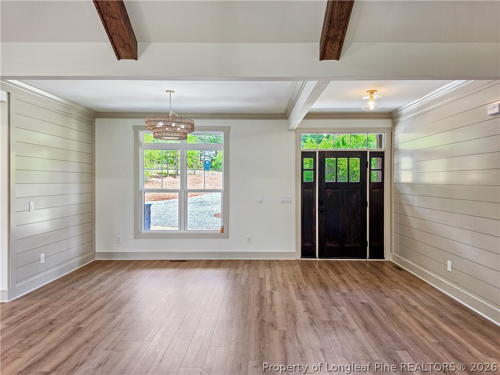 900 Niagara Carthage Road Carthage, NC 28327 - Photo 4 of 38 wooden floor in an empty room with a window