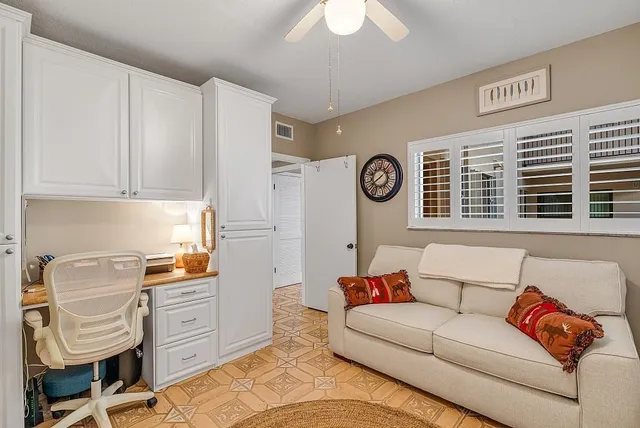 a living room with furniture and a window