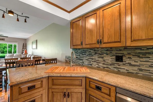 a kitchen with a sink and cabinets