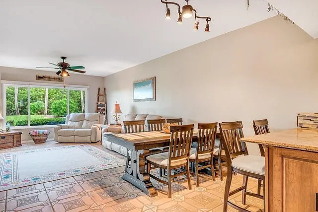 a bedroom with furniture and a large window