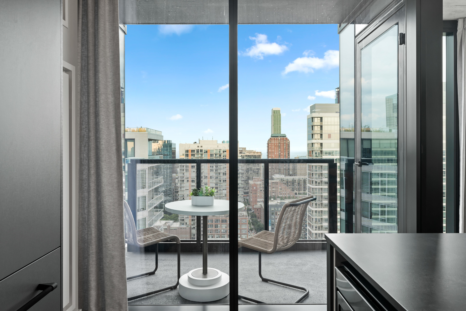 234 West Polk Street, Unit 2509 Chicago, IL 60607 - Photo 17 of 36 a city view from a balcony