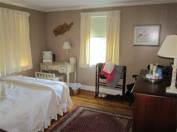 7 Hillcrest Road Marblehead, MA 01945 - Photo 9 of 15 a bedroom with a bed and wooden floor