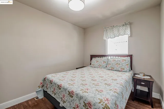 a bedroom with a bed and window