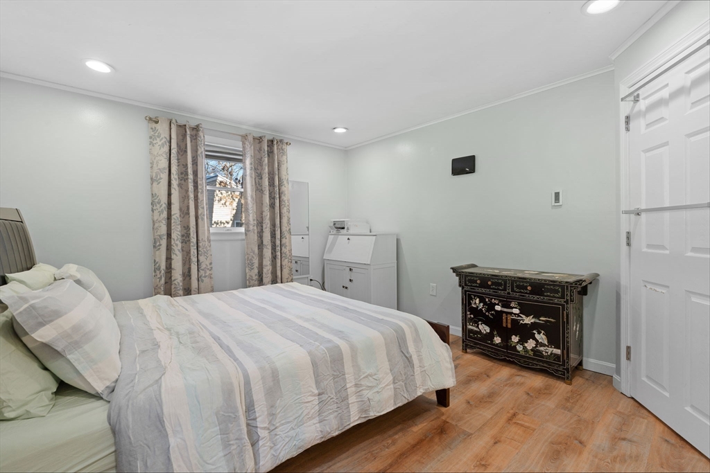 2 Brandywine Drive Hooksett, NH 03106 - Photo 11 of 42 a bedroom with a bed and wooden floor