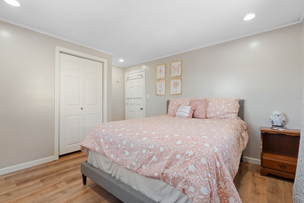 2 Brandywine Drive Hooksett, NH 03106 - Photo 15 of 42 a bedroom with a bed and wooden floor