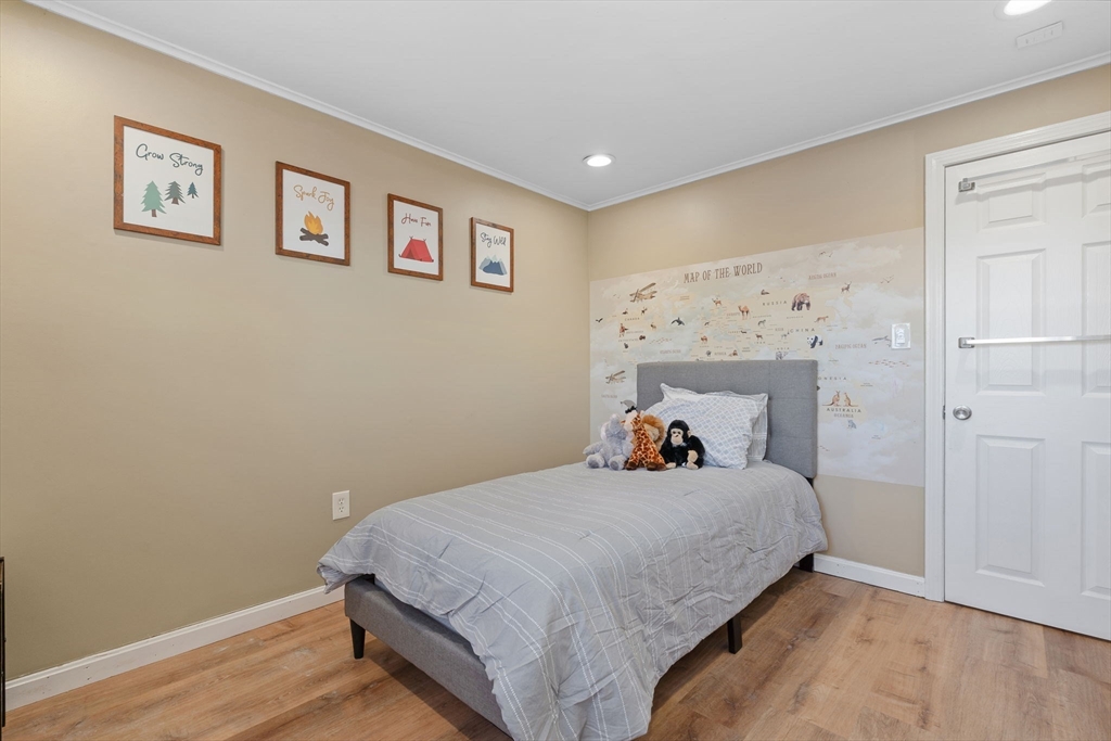 2 Brandywine Drive Hooksett, NH 03106 - Photo 17 of 42 a bedroom with a bed and a painting on the wall