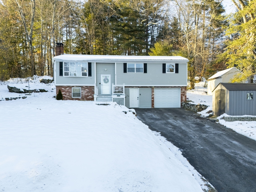 2 Brandywine Drive Hooksett, NH 03106 - Photo 2 of 42 a view of a house with a yard covered in snow