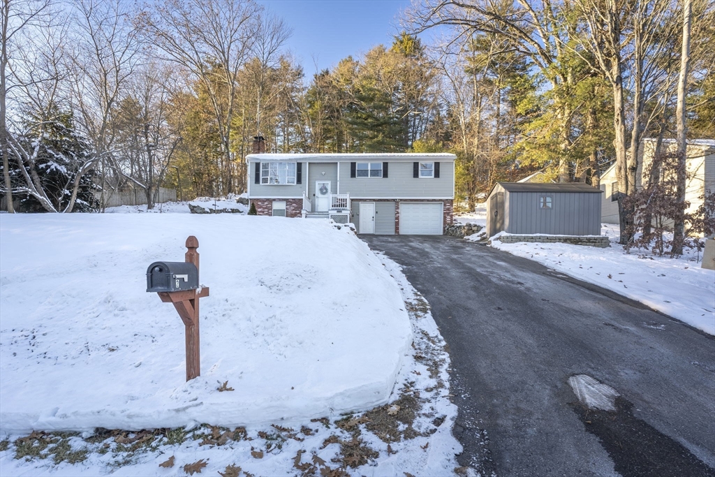 2 Brandywine Drive Hooksett, NH 03106 - Photo 42 of 42 a backyard of a house with a yard and garage