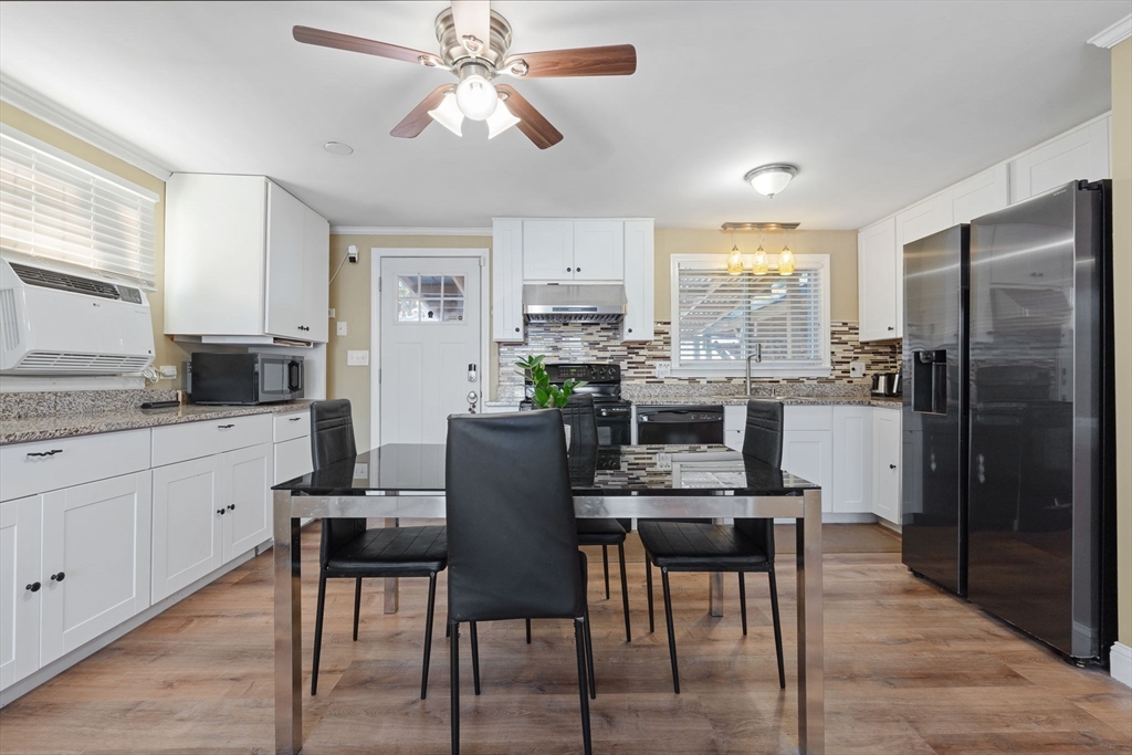 2 Brandywine Drive Hooksett, NH 03106 - Photo 6 of 42 a kitchen with kitchen island granite countertop a counter space dining table and stainless steel appliances