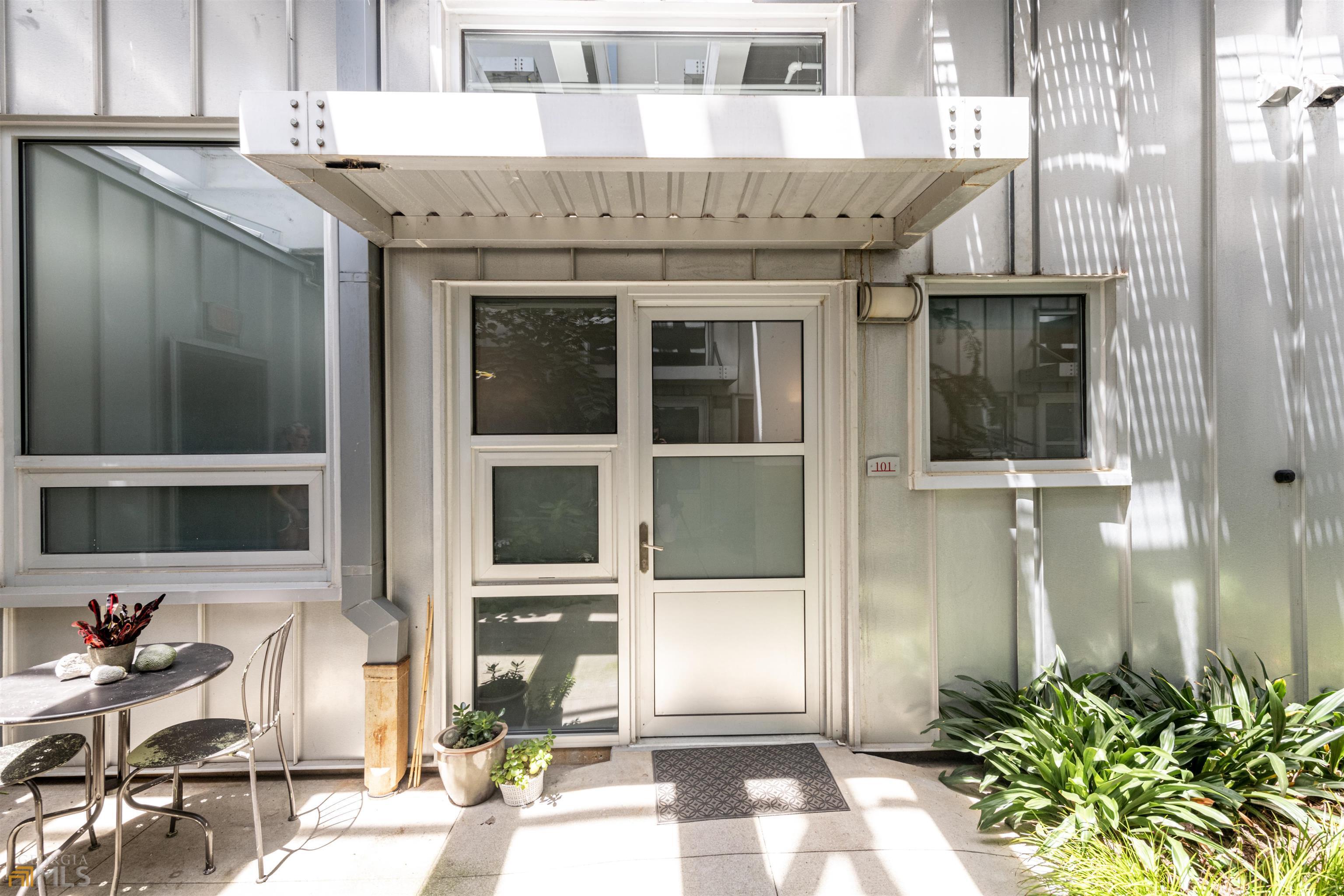 1661 Northeast Ne La, Unit 101 Atlanta, GA 30307 - Photo 1 of 1 a front view of a house with a glass windows