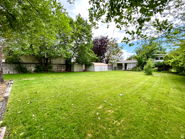 441 South 400 East Payson, UT 84651 - Photo 36 of 39 Expansive green lawn with mature trees and perimeter fencing