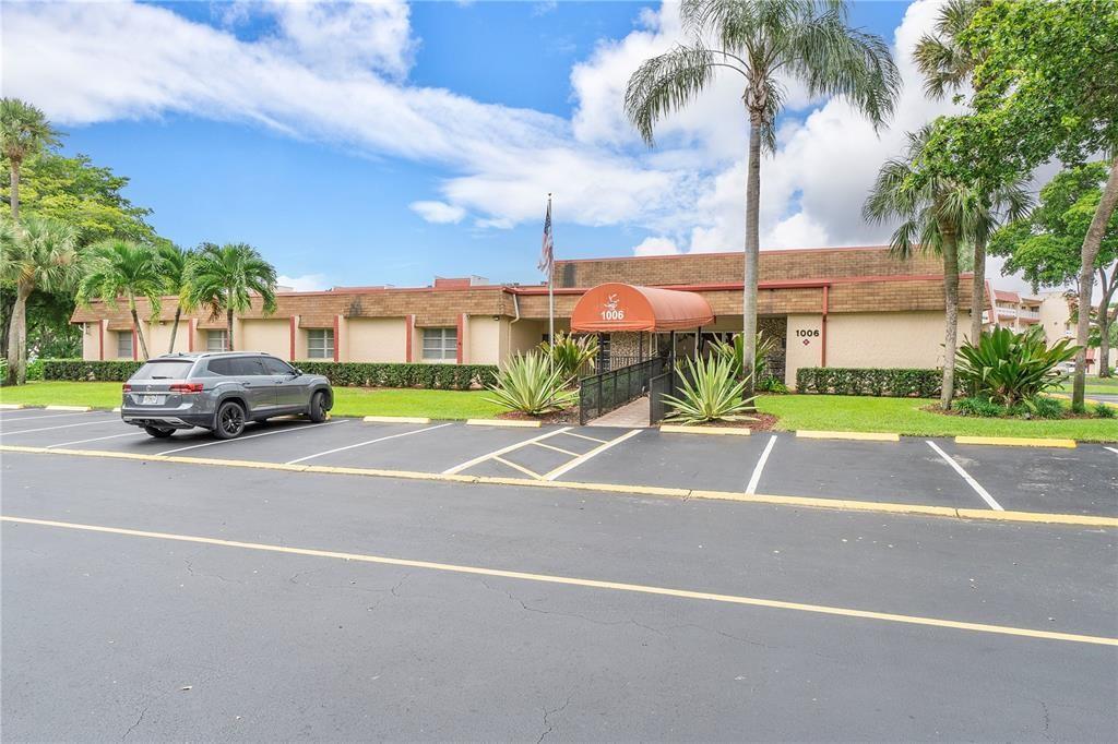 1010 Country Club Drive, Unit 108 Margate, FL 33063 - Photo 11 of 19 a street with cars parked in front of it