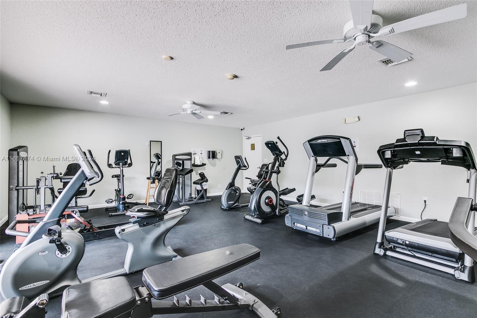1010 Country Club Drive, Unit 108 Margate, FL 33063 - Photo 13 of 19 a view of a room with gym equipment