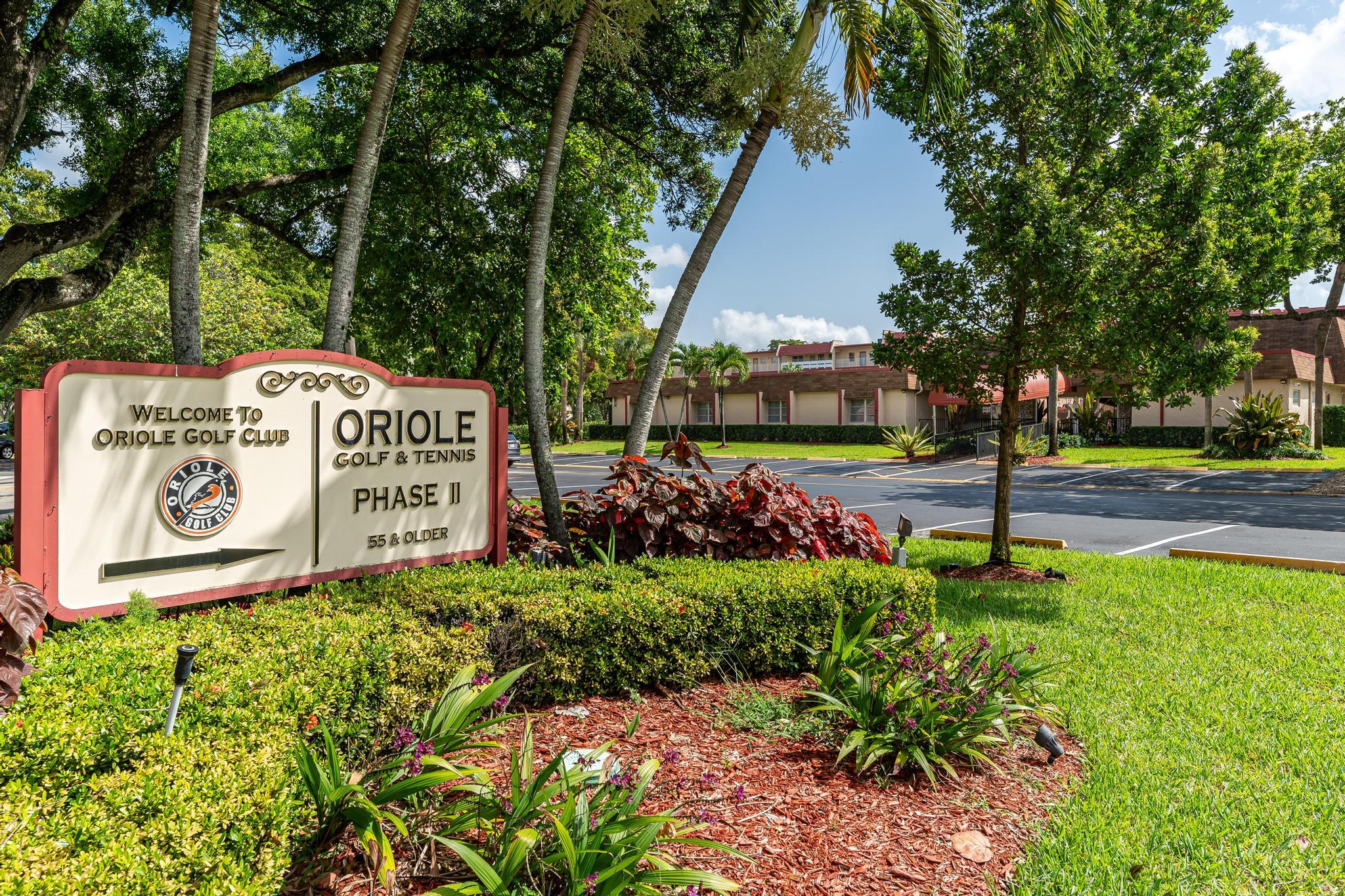 1010 Country Club Drive, Unit 108 Margate, FL 33063 - Photo 16 of 19 a view of a street with sign board