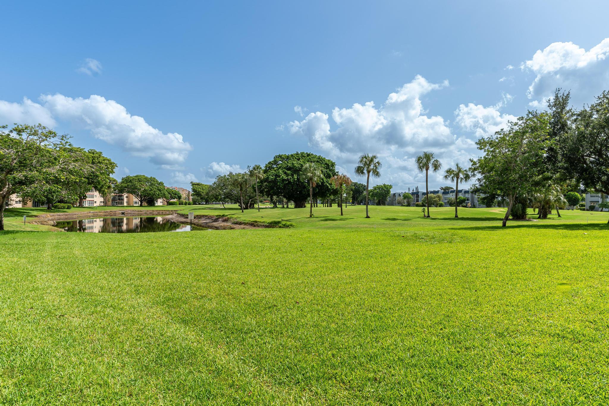 1010 Country Club Drive, Unit 108 Margate, FL 33063 - Photo 18 of 19 a view of a golf course