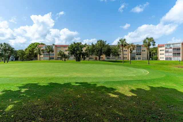 a view of a building with a big yard