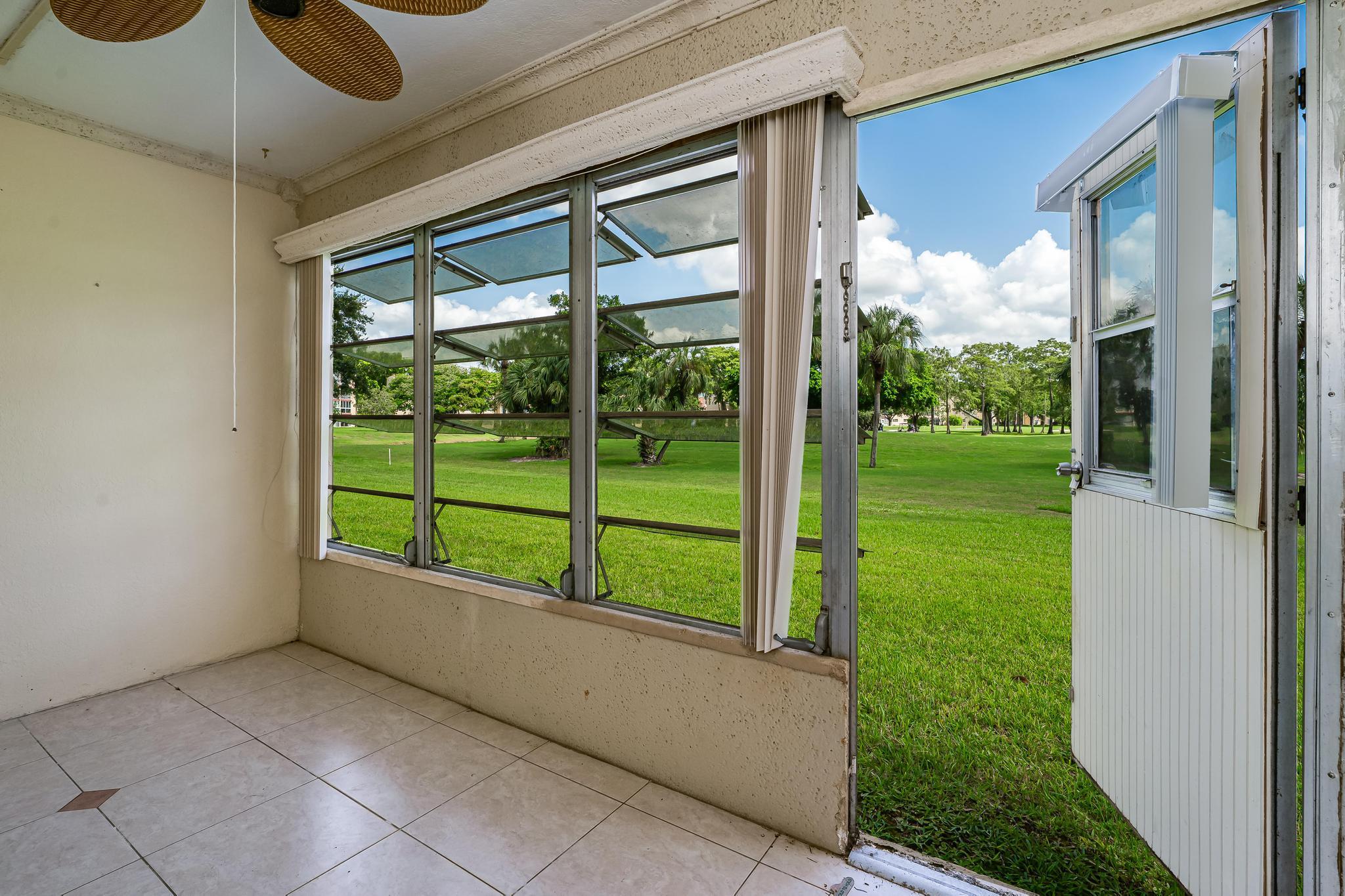 1010 Country Club Drive, Unit 108 Margate, FL 33063 - Photo 3 of 19 a view of outdoor space and balcony