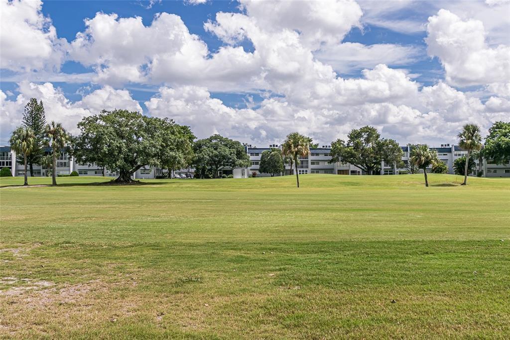 1010 Country Club Drive, Unit 108 Margate, FL 33063 - Photo 9 of 19 a view of a ocean with a big yard