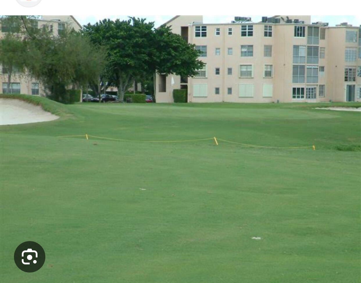 1010 Country Club Drive, Unit 108 Margate, FL 33063 - Photo 10 of 19 a view of building with outdoor space
