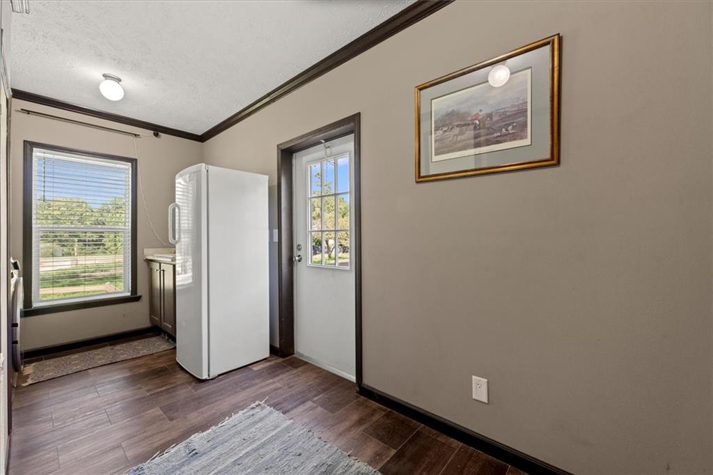 170 Anoia Road Washington, GA 30673 - Photo 27 of 46 an empty room with wooden floor and windows