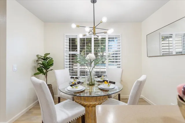 a view of a dining room with furniture window and outside view