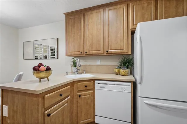 a kitchen with a cabinets and a window
