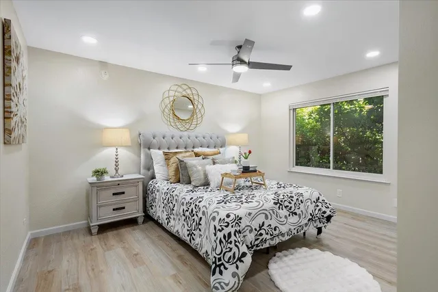 a bedroom with a bed and a window