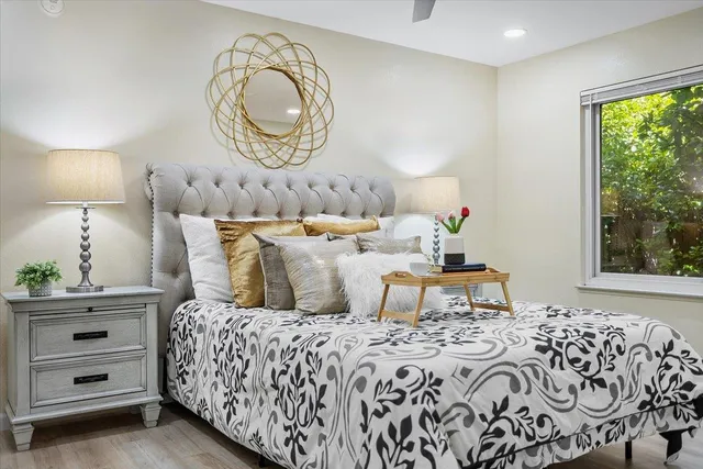 a bedroom with bed and a window