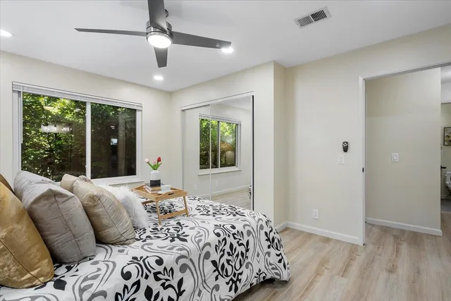 a bedroom with bed and a window