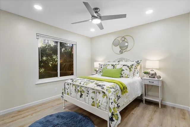 a bedroom with a bed and window