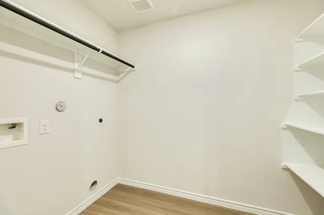 a view of small space with racks on the wall