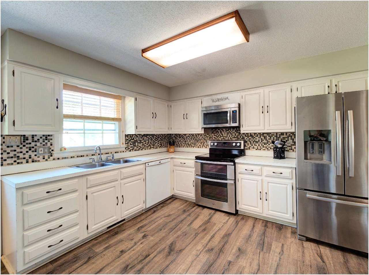 Window Over Sink with View of Backyard. Watch the kids and pets romp and play. Kitchen