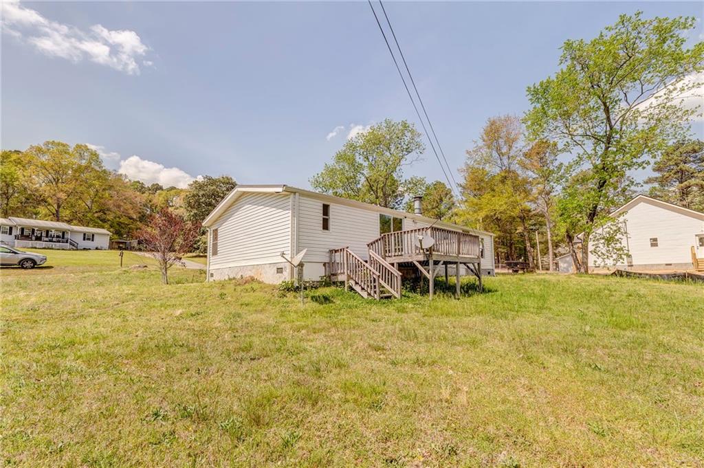 109 Webb Drive Northeast Calhoun, GA 30701 - Photo 11 of 49 a backyard of a house with table and chairs
